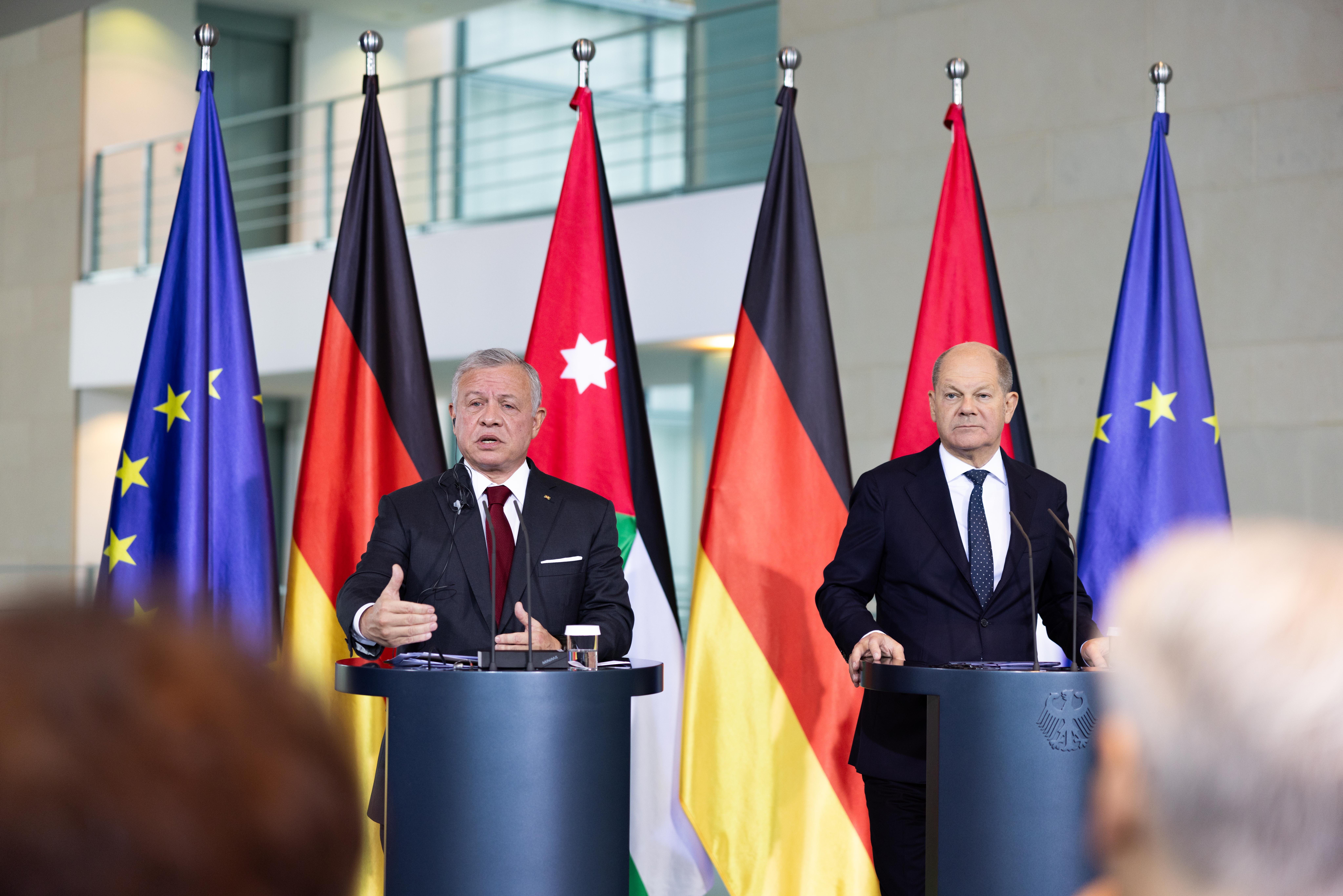 His Majesty King Abdullah speaks to the press with German Chancellor Olaf Scholtz after their talks in Berlin on Tuesday (Photo courtesy of Royal Court)